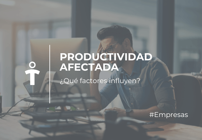 Hombre en una oficina trabajando frente a una PC con el texto: Productividad afectada — ¿Qué factores influyen? #Empresas