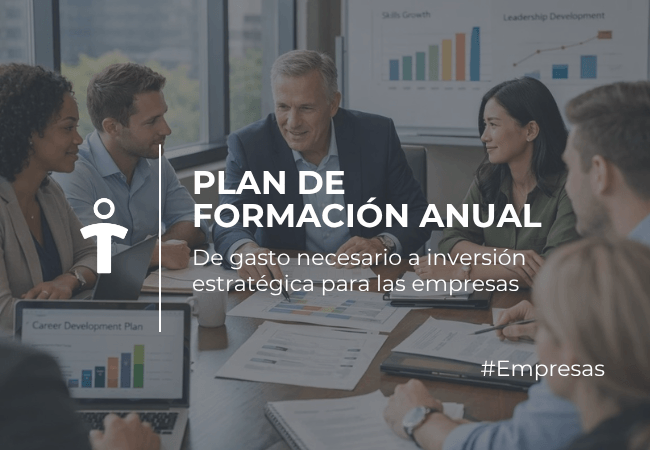 Group of professionals around a conference table collaborating on an annual training plan with charts and graphs on the wall